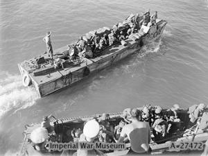 Indian troops embarking from the cruiser HMS KENYA