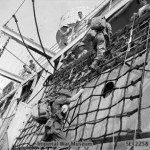 Troops scramble down to a landing craft at the start of the invasion of Ramree Island